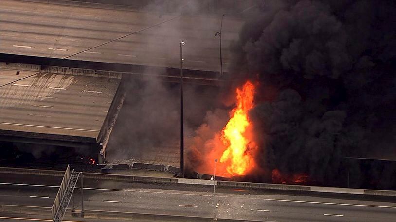 In this aerial image made from a video provided by WSB-TV, a large fire that caused an overpass on Interstate 85 to collapse burns in Atlanta, Thursday, March 30, 2017. (WSB-TV via AP)