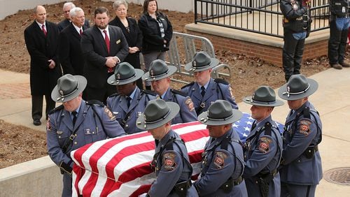 December 11, 2016, AMERICAS: Americus police officer Nicholas Ryan Smarr arrives by honor guard to his funeral service at the Georgia Southwestern State University Storm Dome on Sunday, Dec. 11, 2016, in Americas. Officer Smarr and Georgia Southwestern State University campus police officer Jody Smith were killed responding to a domestic dispute.   Curtis Compton/ccompton@ajc.com