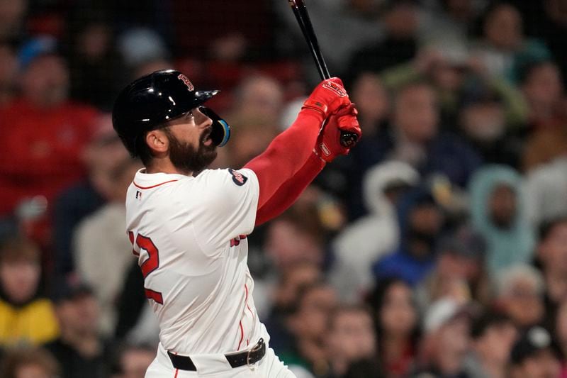 Boston Red Sox's Connor Wong watches his solo home run off Cleveland Guardians pitcher Ben Lively during the fourth inning of a baseball game Wednesday, April 17, 2024, in Boston. (AP Photo/Charles Krupa)