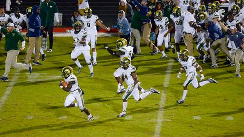 Victory, Victory!! The Grayson Rams storm the field after defeating the Archer Tigers in overtime Friday in a battle of Gwinnett County teams. (Daniel Varnado/Special)