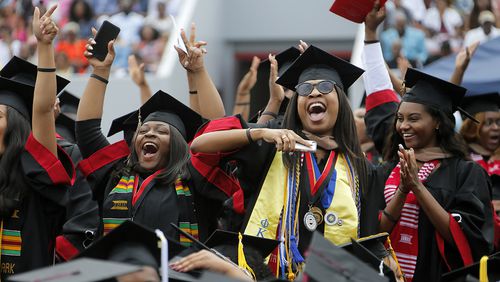 Graduates cheer during Clark Atlanta University's 2017 graduation ceremony. The future may be bright for these grads, but the future for some HBCU institutions is less certain. (BOB ANDRES  /BANDRES@AJC.COM)