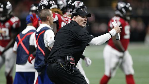 Atlanta Falcons head coach Dan Quinn speaks to players against the Green Bay Packers during the first of an NFL football game, Sunday, Sept. 17, 2017, in Atlanta. (AP Photo/John Bazemore)
