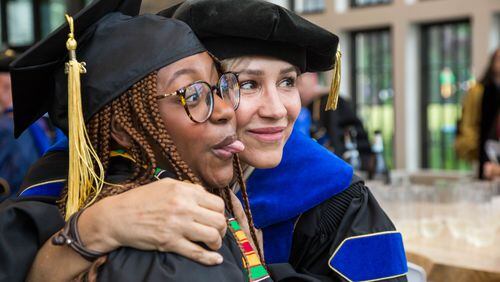 These two Oglethorpe University celebrate at the school's commencement on May 18, 2024. Photo Credit: Henry Bradley/Highlight Media.