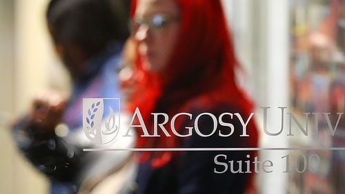 Argosy University students wait inside the Atlanta Campus to find out information on the future of the university on Thursday, March 7, 2019, in Dunwoody. Cash-strapped Argosy University may close its Atlanta campus for good on Friday.