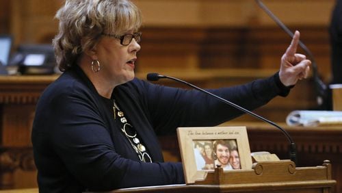 With a photo of an unidentified opioid victim on the lectern, state Sen. Renee Unterman, R-Buford, presents Senate Bill 352, one of two omnibus bills the Senate passed Wednesday that aim to gain control over the opioid crisis in Georgia. She was making a point that children can die after trying the drug even one time. BOB ANDRES /BANDRES@AJC.COM