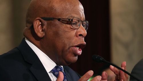 Rep. John Lewis (D-GA), reads a statement speaking out against Attorney General nominee Jeff Sessions (R-AL), during a Senate Judiciary Committee hearing on Capitol Hill, January 11, 2017 in Washington, DC. (Photo by Mark Wilson/Getty Images)