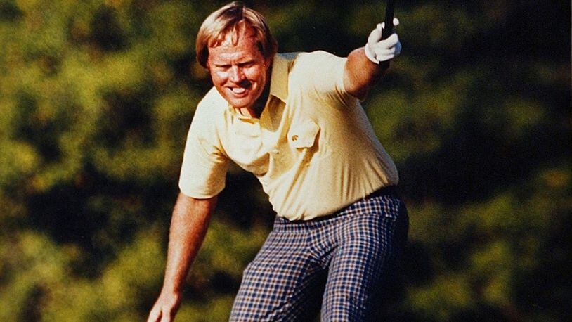 Jack Nicklaus takes pleasure in watching his putt drop for a birdie on the 17th hole at Augusta National on April 13, 1986.