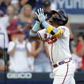 Braves outfielder Ronald Acuna celebrates after hitting a home run off St. Louis Cardinals pitcher Kwang Hyun Kim in the third inning of the second game of a doubleheader on Sunday, June 20, 2021, at Truist Park in Atlanta. (Ben Margot/AP)