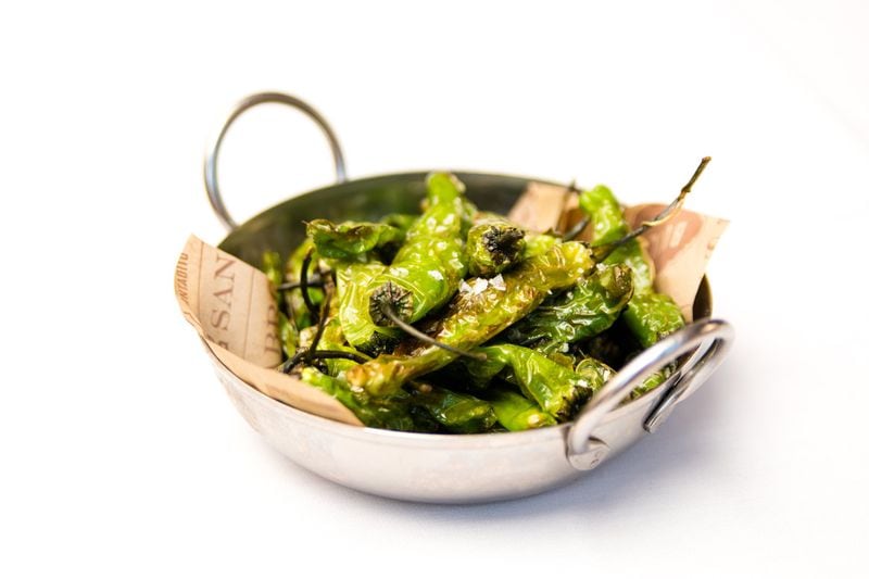 Bulla Gastrobar serves blistered shishito peppers simply dressed with oil and sea salt. CONTRIBUTED BY HENRI HOLLIS