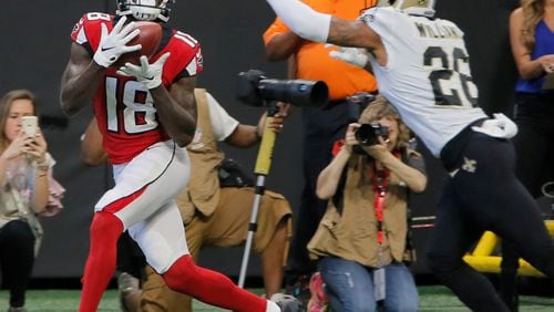 Atlanta Falcons wide receiver Calvin Ridley (18) scores his first TD of the day in the first half.  The Atlanta Falcons played the New Orleans Saints in an NFL football game Sunday, Sept 23, 2018, at Mercedes-Benz Stadium in Atlanta, GA.  BOB ANDRES  /BANDRES@AJC.COM