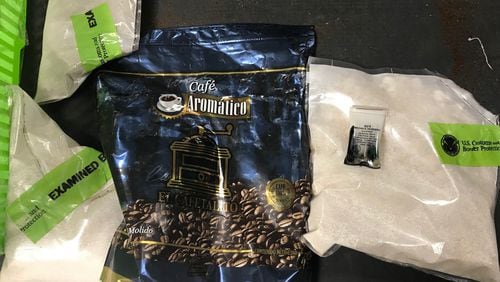 About a kilogram of cocaine was found hidden inside a coffee bag within a Guatemalan man's luggage at the Atlanta airport Friday, authorities said.
