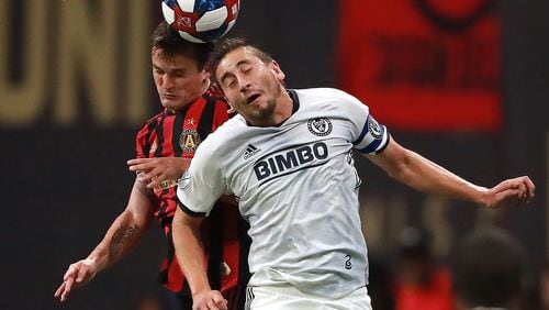 October 24, 2019 Atlanta: Atlanta United player Mikey Ambrose and Philadelphia player Alejandro Bedoya battle for a header in the Eastern Conference semifinals of the MLS playoffs on Thursday, October 24, 2019, in Atlanta.   Curtis Compton/ccompton@ajc.com