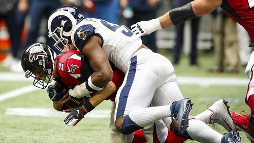 Matt Ryan of the Falcons is sacked by Dante Fowler of the Rams at Mercedes-Benz Stadium on October 20, 2019 in Atlanta. (Photo by Todd Kirkland/Getty Images)