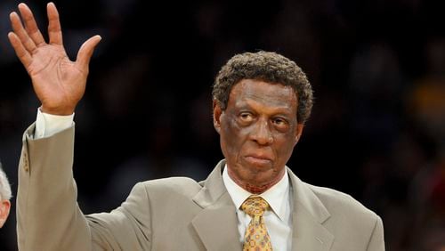 Elgin Baylor waves as is honored along with other members  of the 1974 Los Angeles Lakers Championship team, at half time of an NBA game between the Houston Rockets and the Lakers, Friday, April 6, 2012, in Los Angeles. (Gus Ruelas/AP)