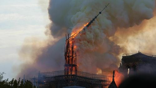 Flames rise from the Notre Dame Cathedral as it burns in Paris on April 15, 2019. SIPA VIA AP IMAGES