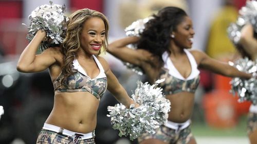 The Falcons cheerleaders wear uniforms to show support for the military while they perform the Arizona Cardinals Sunday, Nov. 27, 2016, at the Georgia Dome in Atlanta. (Curtis Compton/ccompton@ajc.com)