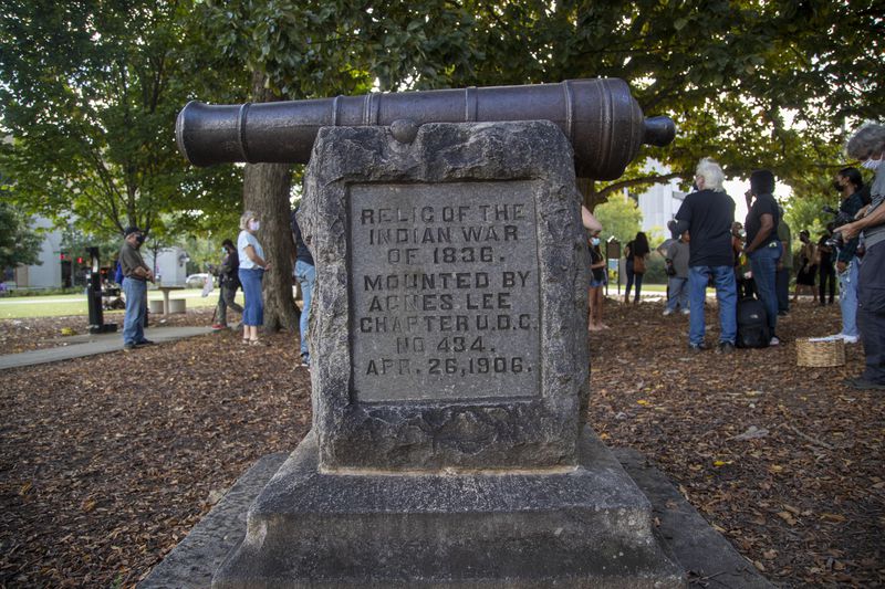 10/11/2021 — Decatur, Georgia —A  cannon monument, installed by the United Daughters of the Confederacy in 1906, is displayed near the Old DeKalb County courthouse  in downtown Decatur, Monday, October 11, 2021. (Alyssa Pointer/ Alyssa.Pointer@ajc.com)