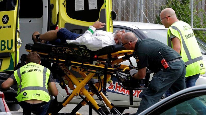 Ambulance staff take a man from outside a mosque in central Christchurch, New Zealand, Friday, March 15, 2019. Multiple people were killed in mass shootings at two mosques full of worshippers attending Friday prayers on what the prime minister called "one of New Zealand's darkest days," as authorities detained four people and defused explosive devices in what appeared to be a carefully planned attack. 