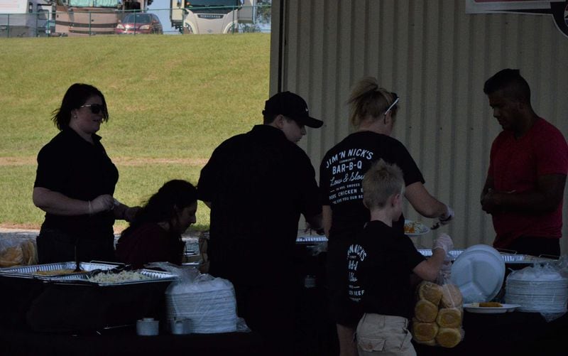 Caterers from Jim 'N Nick's Bar-B-Q prepare food for Hurricane Irma evacuees at Atlanta Motor Speedway. (MITCHELL NORTHAM/AJC)