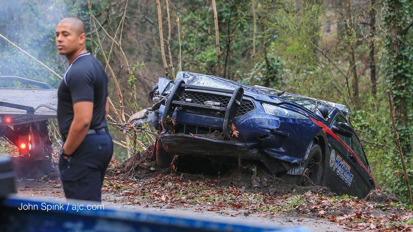 An Atlanta police officer is OK after his patrol car crashed into a power pole on Joseph E. Boone Boulevard. The accident knocked out power to more than 1,000 people early Wednesday.