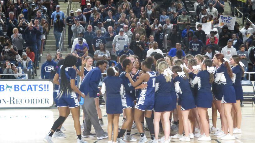 The Elbert County Blue Devis celebrate after defeating the Josey Eagles 56-40 in the Class 2A semifinals on Friday, March 4, 2022 at Georgia College in Milledgeville.
