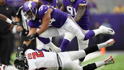 Kendricks of the Minnesota Vikings pushes quarterback Matt Ryan  of the Atlanta Falcons out of bounds (Photo by Hannah Foslien/Getty Images)