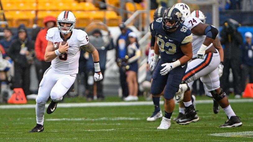 PITTSBURGH, PA - OCTOBER 28: Kurt Benkert #6 of the Virginia Cavaliers carries the ball for a 10 yard gain in the first quarter during the game against the Pittsburgh Panthers at Heinz Field on October 28, 2017 in Pittsburgh, Pennsylvania. (Photo by Justin Berl/Getty Images)