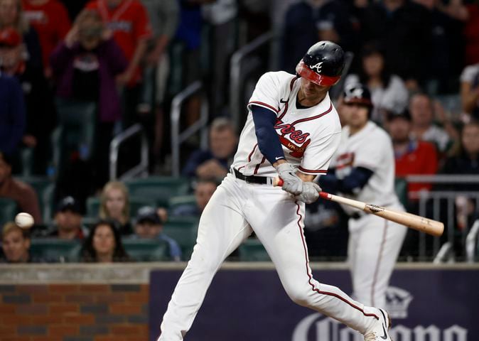 Atlanta Braves first baseman Matt Olson (28) hits an RBI single against the Philadelphia Phillies during the sixth inning of game two of the National League Division Series at Truist Park in Atlanta on Wednesday, October 12, 2022. (Jason Getz / Jason.Getz@ajc.com)