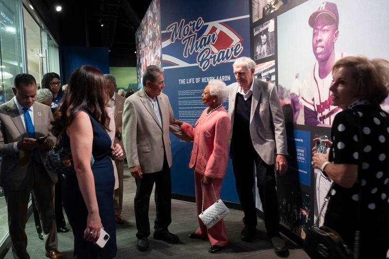 Billye Aaron talks with a member of the Braves 1974 team during the opening of the Atlanta History Center exhibit “More Than Brave: The Life of Henry Aaron” on Monday, April 8, 2024.   (Ben Gray / Ben@BenGray.com)