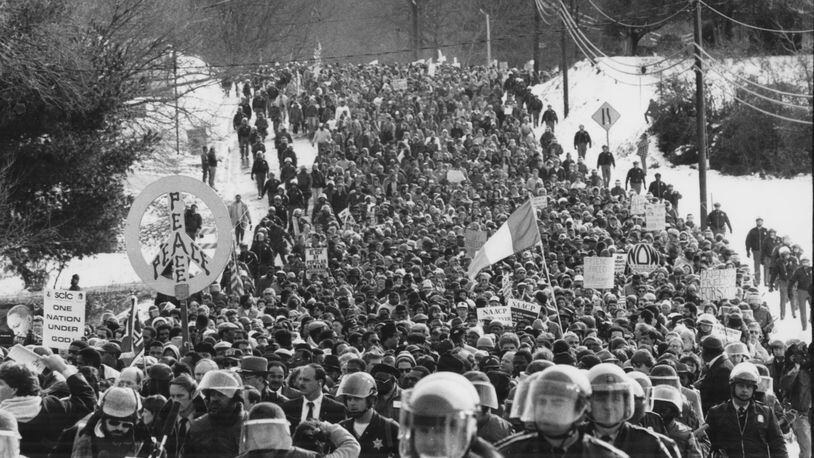 870117 - Brotherhood march in Forsyth County, GA is flanked by law enforcement personnel on January 17, 1987. (RICH ADDICKS/AJC staff)