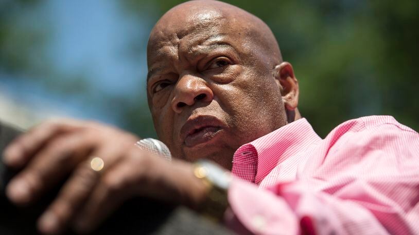 April 29, 2017, Atlanta - Rep. John Lewis speaks to the crowd at a Moms Demand Action for Gun Sense in America rally at Woodruff Park in Atlanta, Georgia, on Saturday, April 29, 2017. The group called for action against gun violence and was critical of of the NRA, which is hosting a convention in Atlanta at the same time. (DAVID BARNES / DAVID.BARNES@AJC.COM)