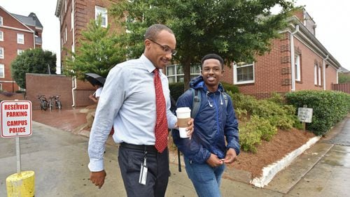 Morehouse College interim president Harold Martin chats with student Solomon Enders as they walk to the school cafeteria at Morehouse College on Wednesday, Aug. 30, 2017. Morehouse continues its search for a full-time president. The job could go to Martin, who’s father is also president of a HBCU. HYOSUB SHIN / HSHIN@AJC.COM