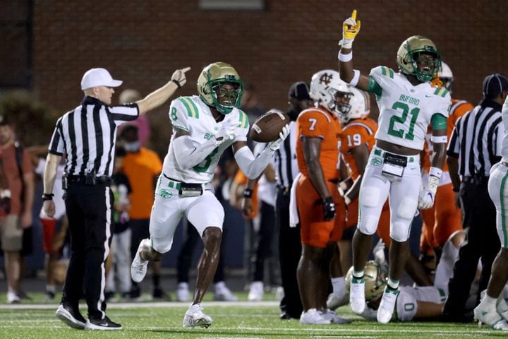 August 20, 2021 - Kennesaw, Ga: Buford defensive back Ryland Gandy (8) celebrates a fumble recovery with defensive back Tyshun White (21) during the second half against North Cobb at North Cobb high school Friday, August 20, 2021 in Kennesaw, Ga.. Buford won 35-27. JASON GETZ FOR THE ATLANTA JOURNAL-CONSTITUTION