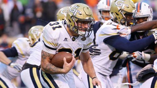 CHARLOTTESVILLE, VA - NOVEMBER 4: Nathan Cottrell #31 of the Georgia Tech Yellow Jackets rushes with the ball in the third quarter during a game against the Virginia Cavaliers at Scott Stadium on November 4, 2017 in Charlottesville, Virginia. Virginia defeated Georgia Tech 40-36. (Photo by Ryan M. Kelly/Getty Images)