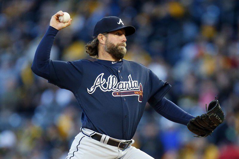  It's been an up-and-down season for 42-year-old knuckleballer R.A. Dickey, whose contributions to the young Braves team have extended beyond his performance on the mound. (Getty Images)