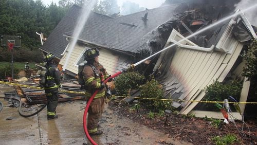 Cherokee firefighters battle a blaze that destroyed a BridgeMill home overnight.