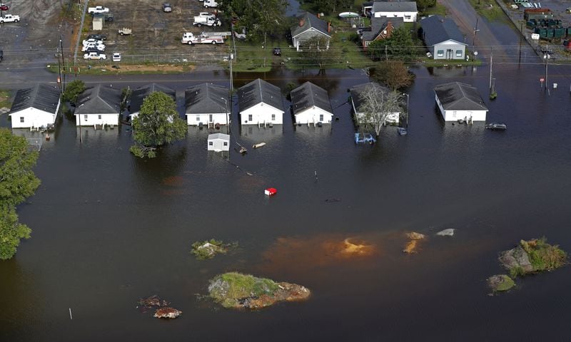 Floodwaters from Hurricane Florence surround homes Monday in Dillon in 2018. The small town in the Pee Dee region has held onto a fairly stable population over the years.