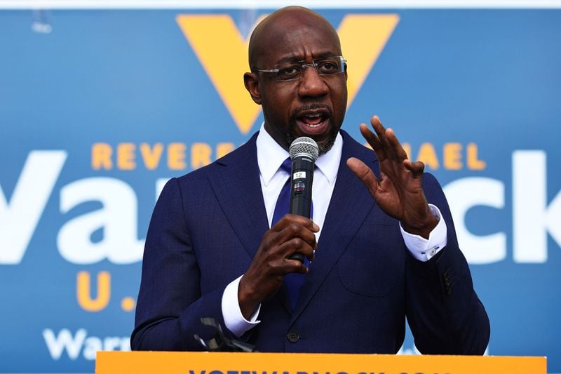 Sen. Raphael Warnock, shown campaigning in January 2021, tested positive for COVID-19 this week, along with Sen. Susan Collins and others. (Michael M. Santiago/Getty Images/TNS)