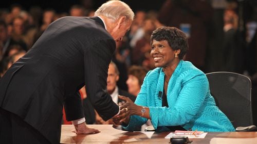 FILE - In this Oct. 2, 2008, file photo, PBS journalist and debate moderator Gwen Ifill and then-Democratic vice presidential nominee, Sen. Joe Biden, D-Del., left, shake hands at the end of his vice presidential debate with Republican rival, Alaska Gov. Sarah Palin in St. Louis, Mo. Ifill died on Monday, Nov. 14, 2016, of cancer, PBS said. She was 61. (AP Photo/Don Emmert, File Pool)