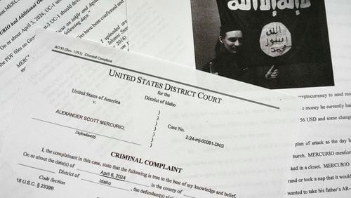 The criminal complaint against Alexander Scott Mercurio is photographed on Tuesday, April 9, 2024. Mercurio, 18, is charged with attempting to provide material support to the Islamic State group after prosecutors said he planned to carry out an attack on a Coeur d'Alene church. Mercurio was arrested Saturday, and the charges were unsealed in Idaho's U.S. District Court on Monday. (AP Photo/Jenny Kane)