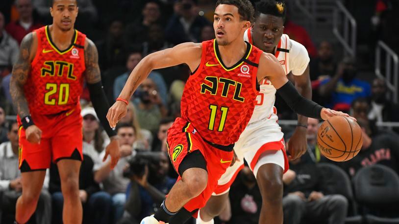 Atlanta Hawks guard Trae Young (11) races upcourt during the first half of an NBA basketball game against the Houston Rockets, Wednesday, Jan. 8, 2020, in Atlanta. (AP Photo/John Amis)
