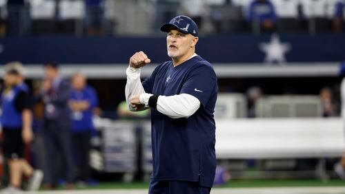 Dallas Cowboys defensive coordinator Dan Quinn watches warmups before an NFL football game against the New York Giants in Arlington, Texas, Sunday, Oct. 10, 2021. (AP Photo/Ron Jenkins)