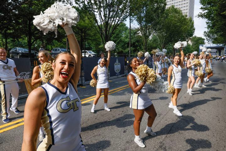 Georgia Tech cheerleaders entertain the crowd before the team arrives.   (Bob Andres for the Atlanta Journal Constitution)