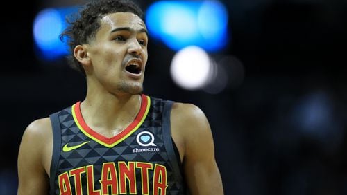 Hawks guard Trae Young reacts after a play against the Hornets Dec. 8, 2019, at Spectrum Center in Charlotte, N.C.