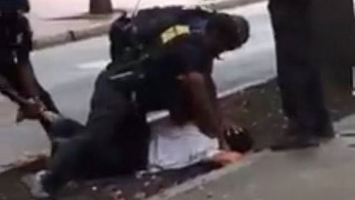 Video that appears to show an Atlanta police officer punching a man in the head. (Credit: Facebook)