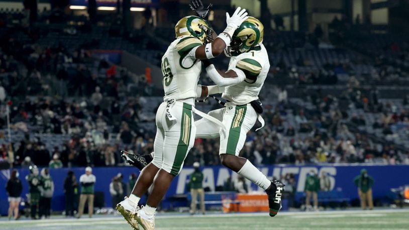 Grayson running back Jayvian Allen (16, left) celebrates a rushing touchdown with wide receiver Jamal Haynes in the first half of the Class 7A state high school football final against Collins Hill Wednesday, Dec. 30, 2020, at Center Parc Stadium in Atlanta. (Jason Getz/For the AJC)
