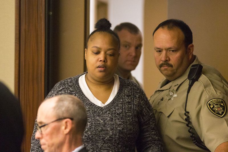 Erica White enters a court room before the opening arguments of her case, Monday, January 22, 2018. (Alyssa Pointer)