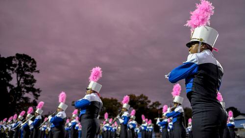 Members of the McEachern marching band perform the National Anthem prior to the start of a 2016 game.