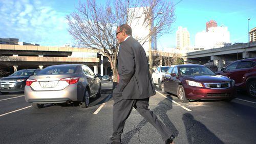 Atlanta contractor Elvin “E.R.” Mitchell Jr. returns to his car after a January hearing where he pleaded guity in the Atlanta City Hall bribery investigation. (HENRY TAYLOR / HENRY.TAYLOR@AJC.COM)