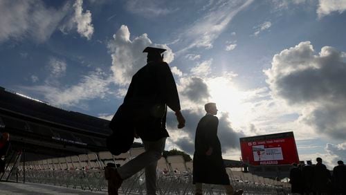 University of Georgia students enter Sanford Stadium during the Spring Undergraduate Ceremony in May 2023. (Jason Getz / Jason.Getz@ajc.com)